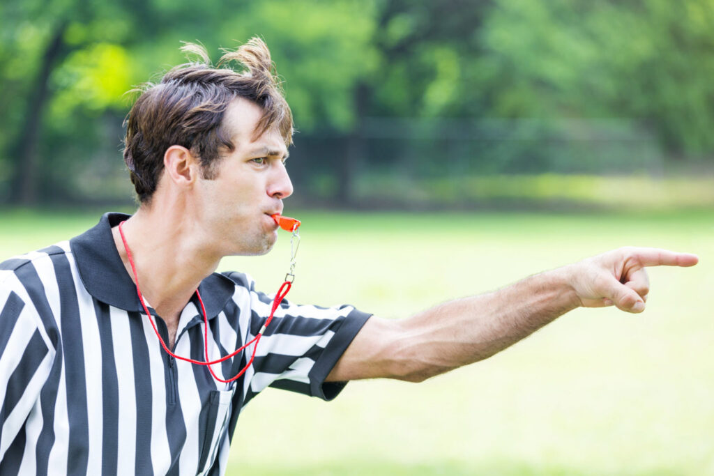 A7FL football referees discussing a call 